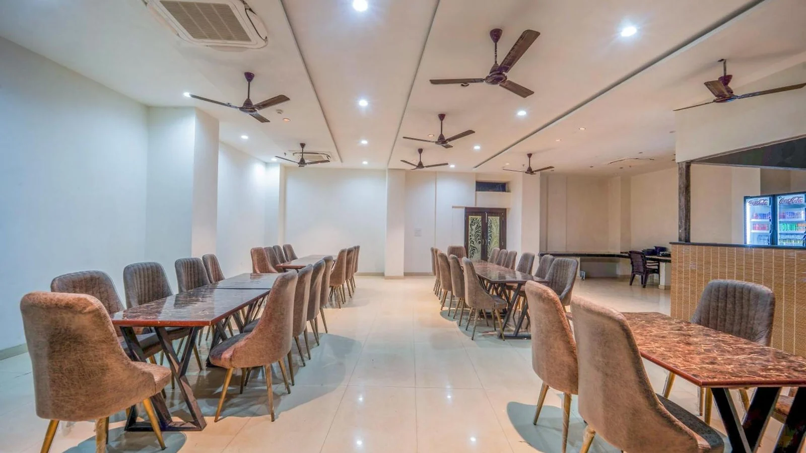 The restaurant at Hotel Augusto, with tables arranged for guests