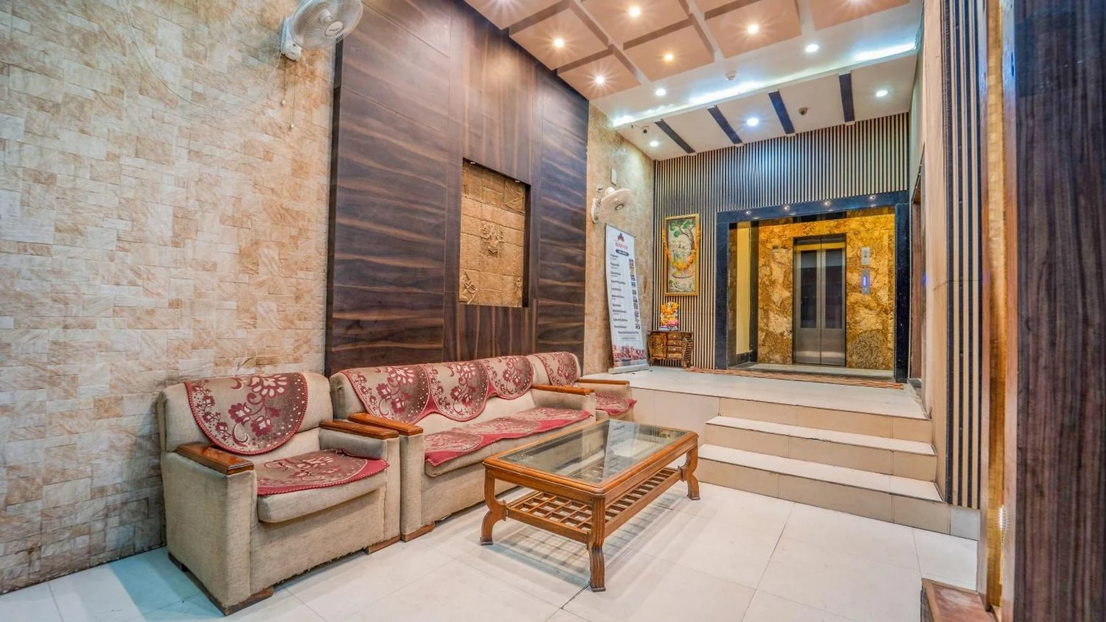 The lounge and seating area inside Hotel Augusto