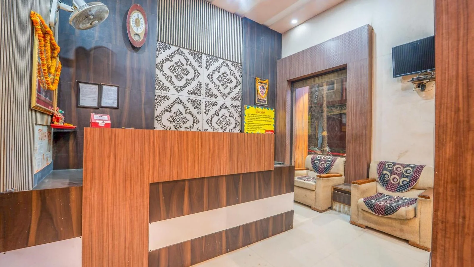 The reception counter and seating at Hotel Augusto